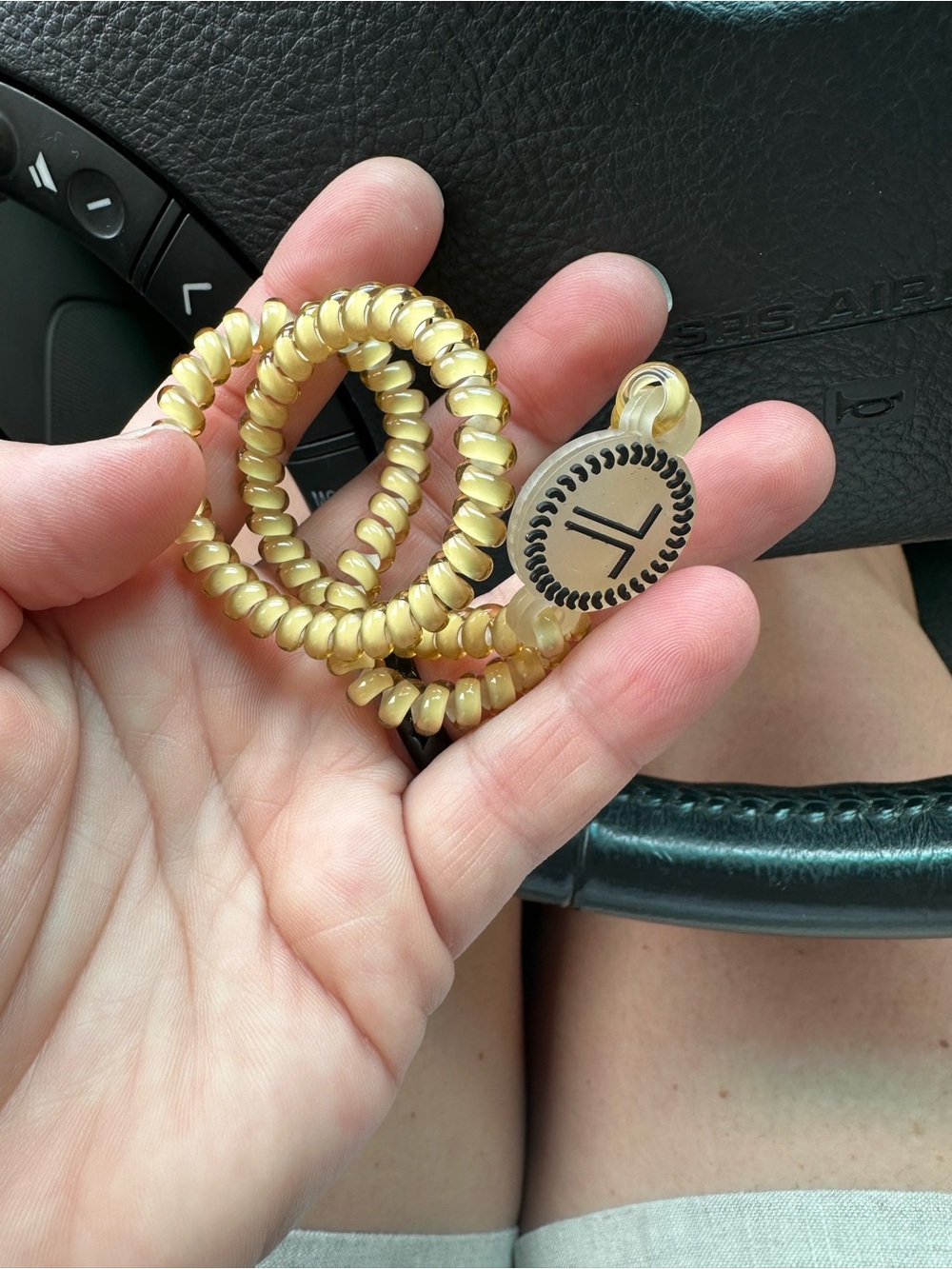 Coiled Elastic Bracelet with Round Logo Charm in Pale Gold